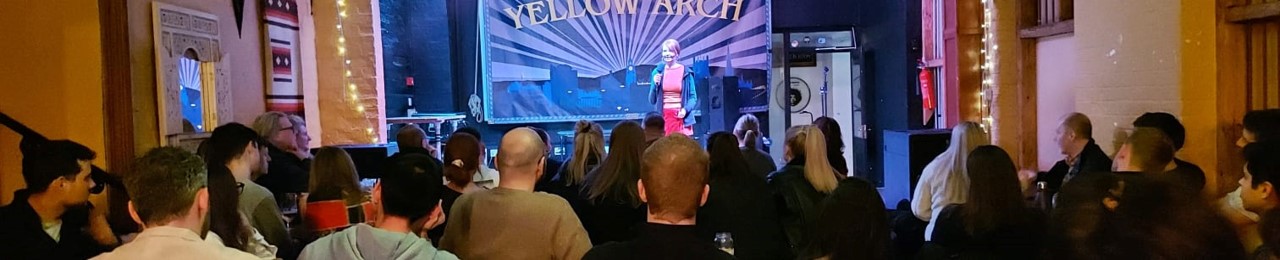 Rachel performing standup comedy