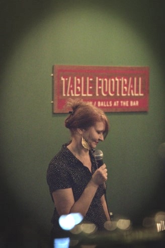 Rachel performing standup comedy